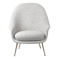 Light gray upholstered chair with a textured pattern and slender metallic legs. Ideal for modern decor settings.