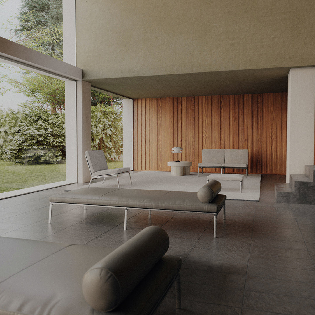 Modern lounge with earthy tones, sleek gray seating, and warm wooden accents, featuring a minimalist design.