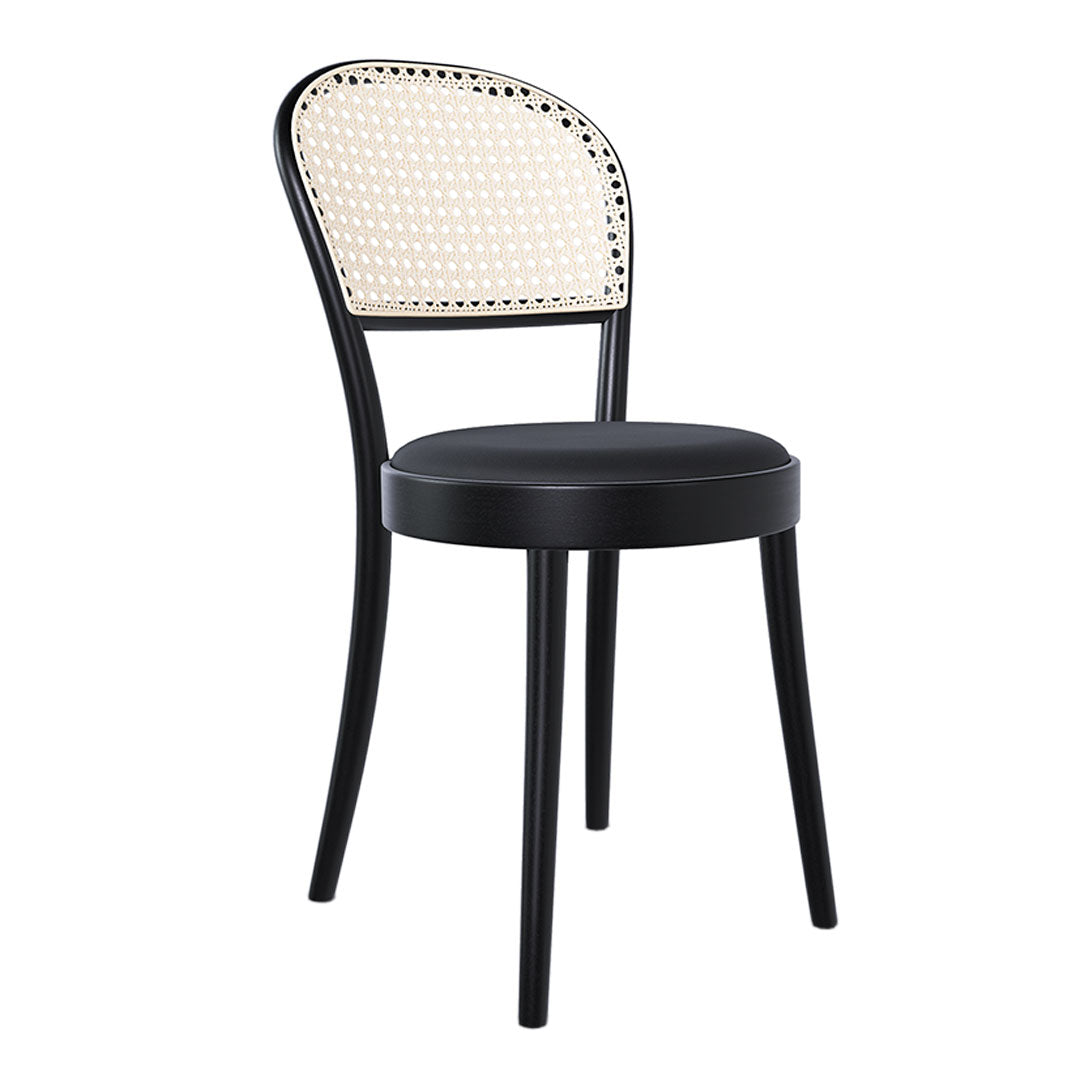 Black chair with a rattan backrest featuring a white woven pattern. Chic and modern design for any space.