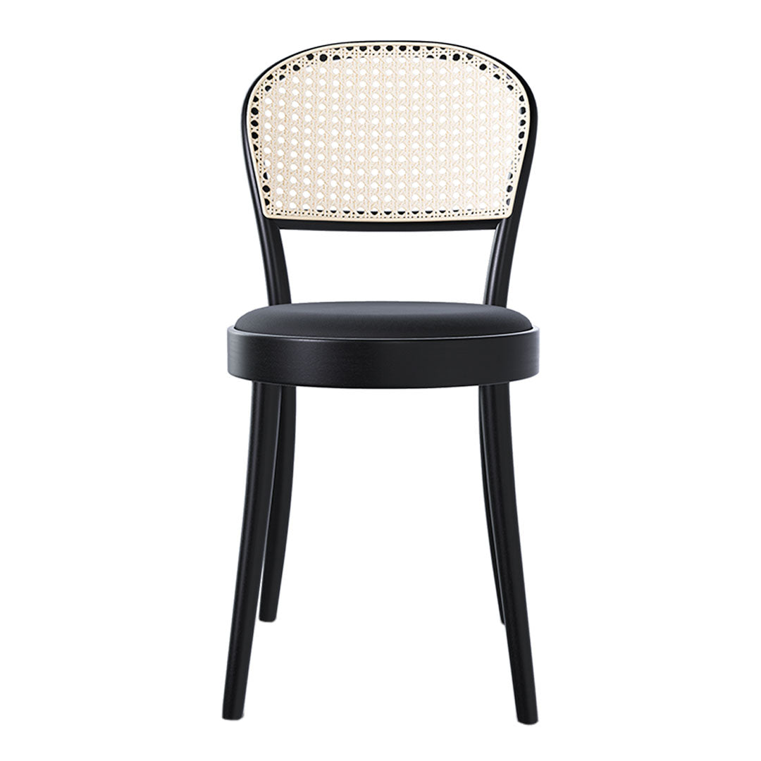 Black chair with a woven rattan backrest, featuring a classic pattern and sleek design elements.