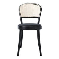 Black chair with a woven rattan backrest, featuring a classic pattern and sleek design elements.