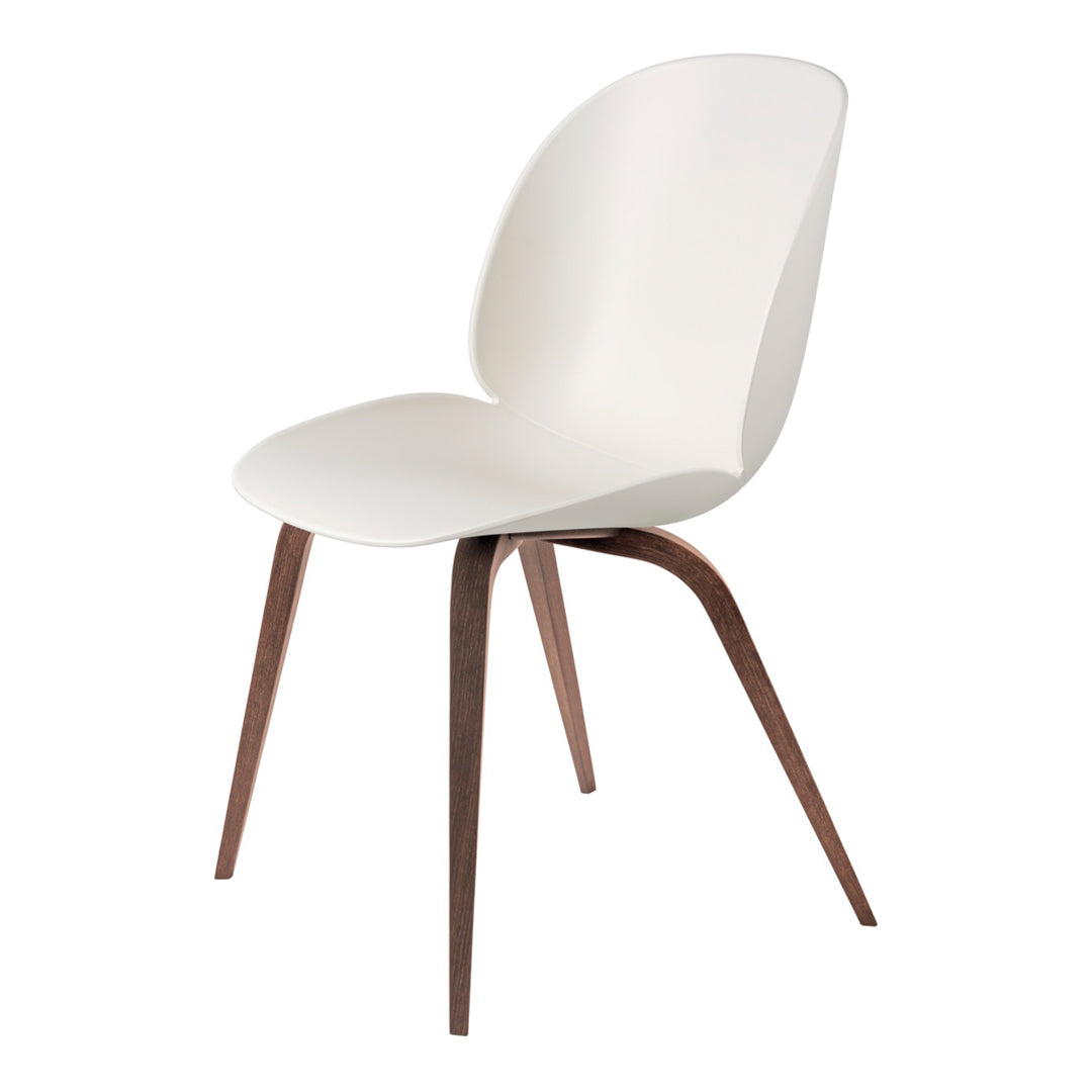 White chair with smooth, curved seat and dark wood legs, perfect for modern decor.