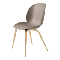 Stylish beige chair with a smooth, curved seat and natural wood legs for a modern look.