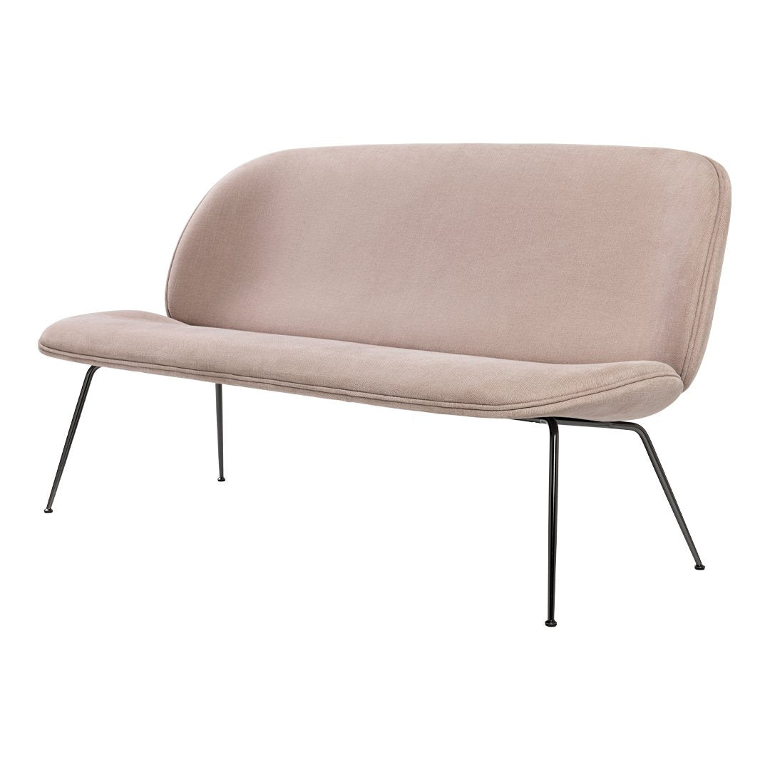 Blush pink fabric sofa with smooth curves and sleek black metal legs, offering a modern, minimalist design.