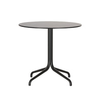 Round gray table with a sleek black base, featuring a minimalistic design and smooth surface.