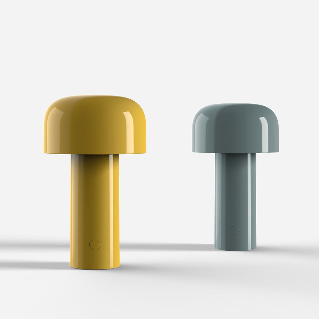 Two glossy mushroom-shaped lamps in vibrant yellow and soft blue, featuring smooth, curved designs.
