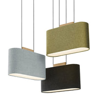 Three hanging lamps in grey, olive green, and black fabric with a sleek, modern design and warm light glow.