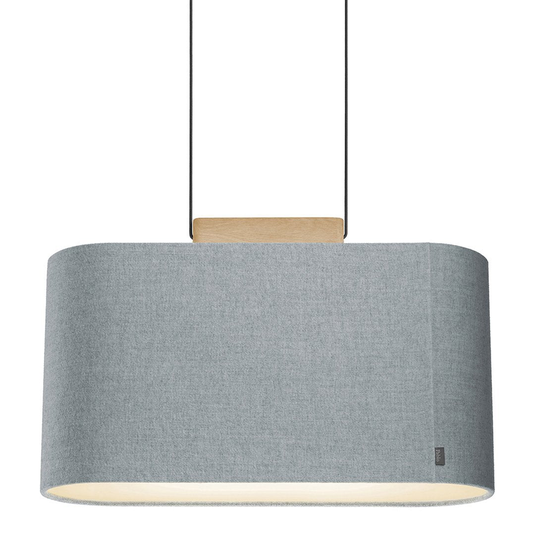 Gray fabric pendant lamp with a smooth cylindrical shape and natural wood accent. Elegant and modern design.