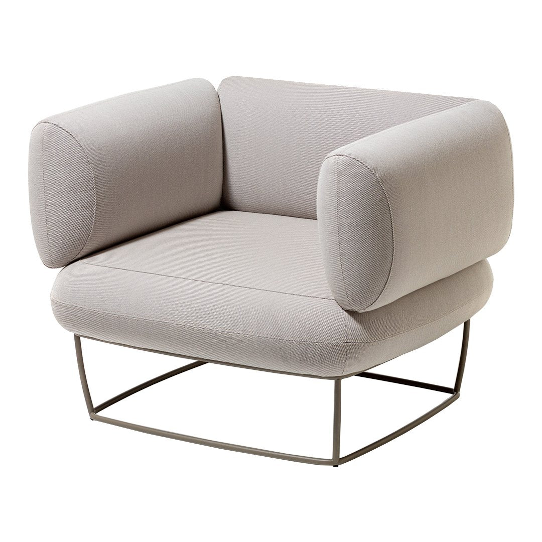Light gray upholstered chair with smooth, rounded cushions and a minimalist metal base. Simple, modern design.