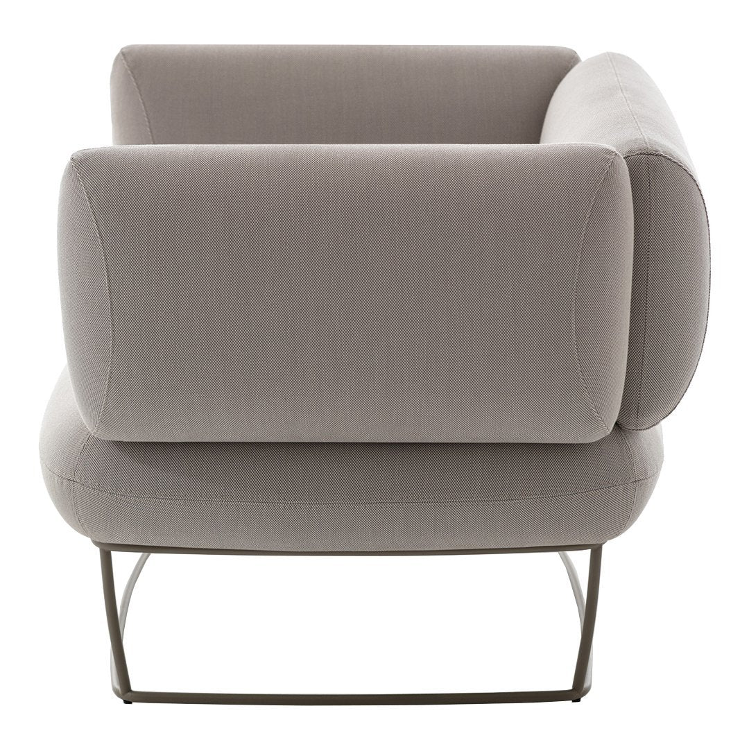 Gray upholstered armchair with smooth, modern lines and minimalist metal frame. Perfect for contemporary decor.