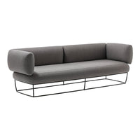 Gray modern sofa with cylindrical armrests and a sleek black metal base. Minimalist design and neutral colors.