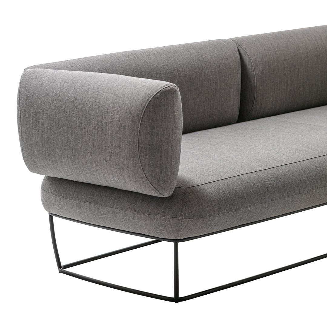 Modern gray sofa with a streamlined design, featuring subtle fabric texture and sleek black metal frame.