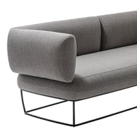 Modern gray sofa with a streamlined design, featuring subtle fabric texture and sleek black metal frame.