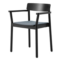 Black armchair with a solid back and blue fabric seat, featuring a minimalistic design and sleek lines.