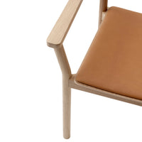 Light wood frame with a smooth, tan leather seat, featuring a minimalist design and natural finish.