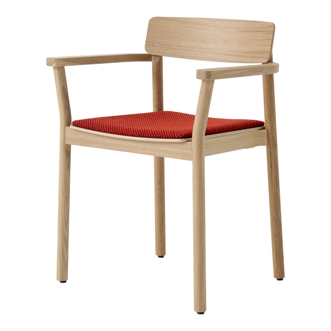 Light wood frame with a bright red padded seat, showcasing a simple and modern design.