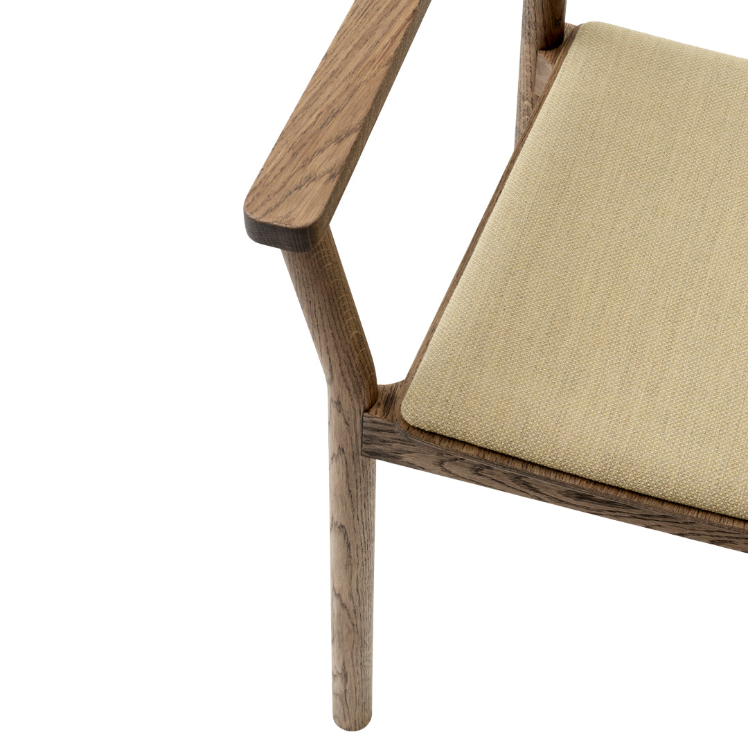 Beige upholstered seat with a light wood frame, featuring clean lines and minimalistic design.