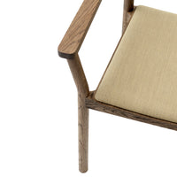 Beige upholstered seat with a light wood frame, featuring clean lines and minimalistic design.