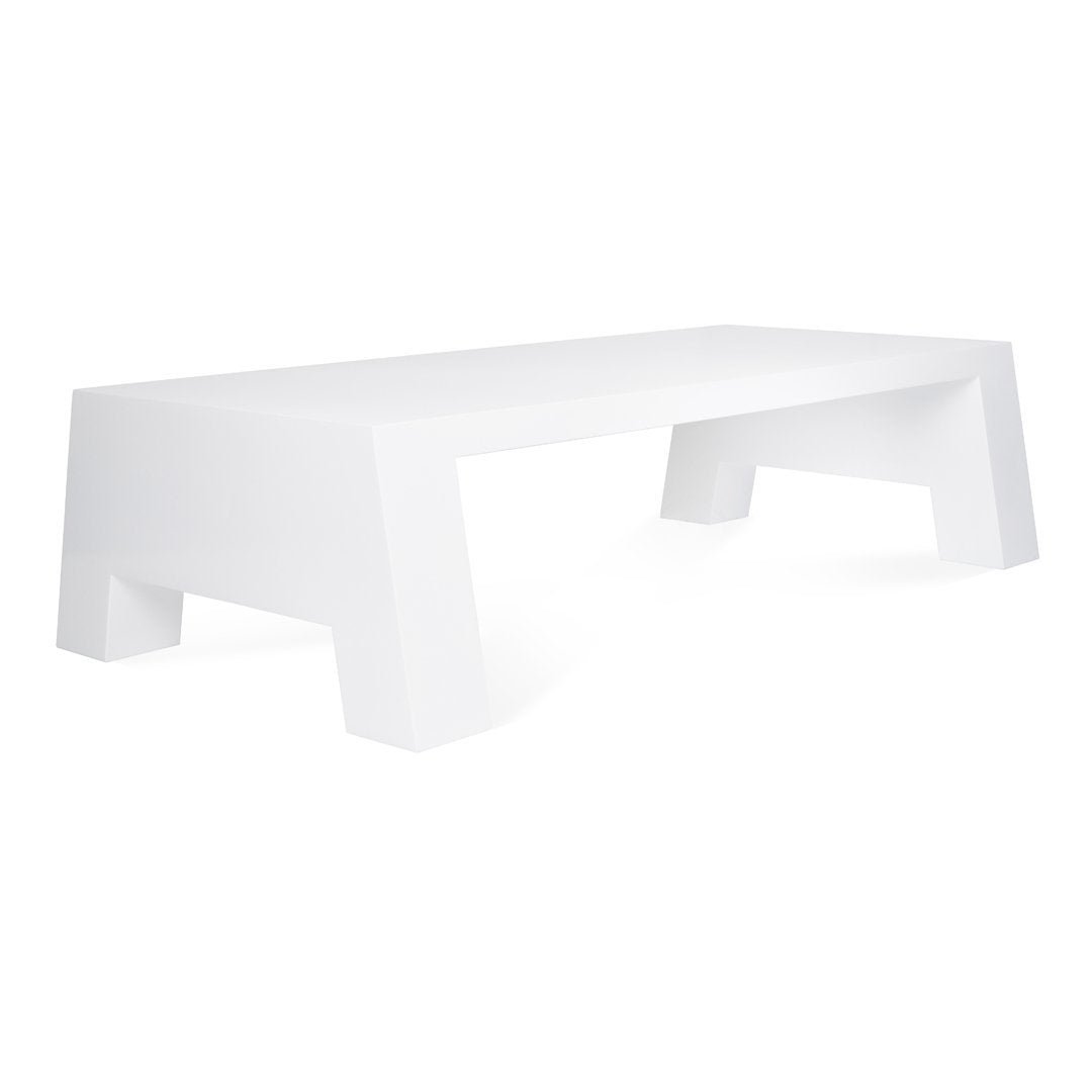 Sleek white table with a minimalist design, featuring clean lines and a smooth, glossy finish. Perfect for modern spaces.