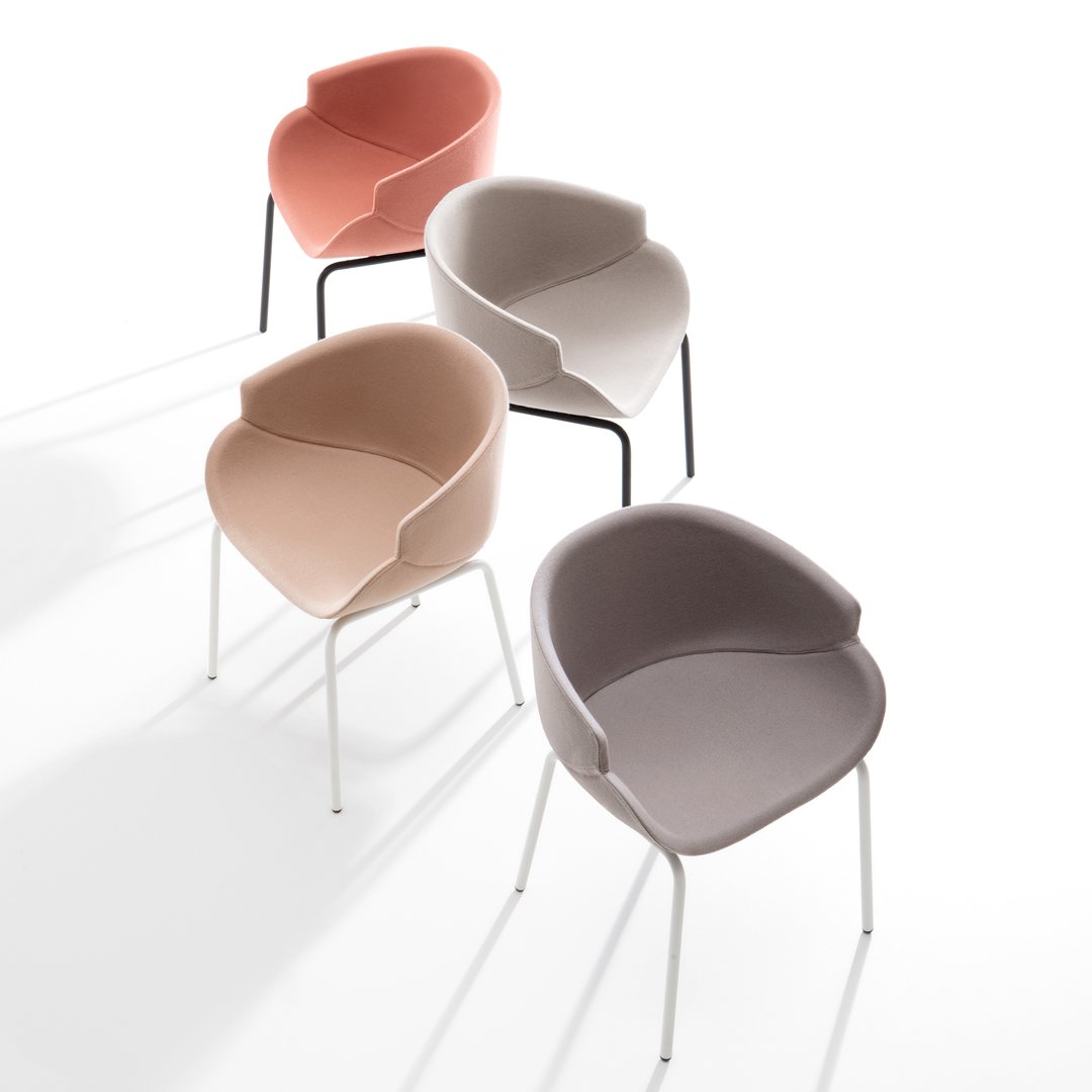 Four contemporary chairs in soft hues: peach, light grey, pink, and taupe, with sleek metal legs and curved designs.