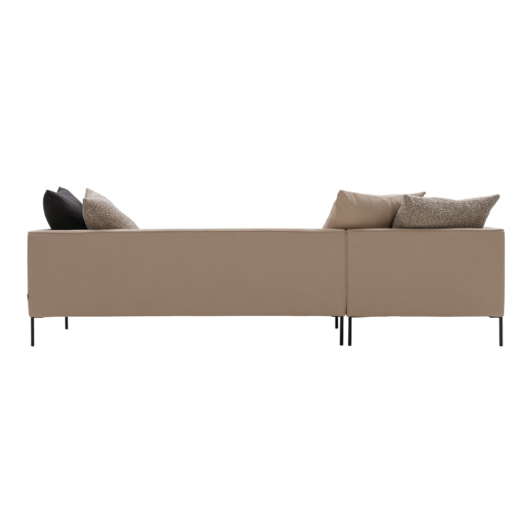 Beige upholstered sofa with black and textured pillows, featuring a modern minimalist design and sleek black legs.