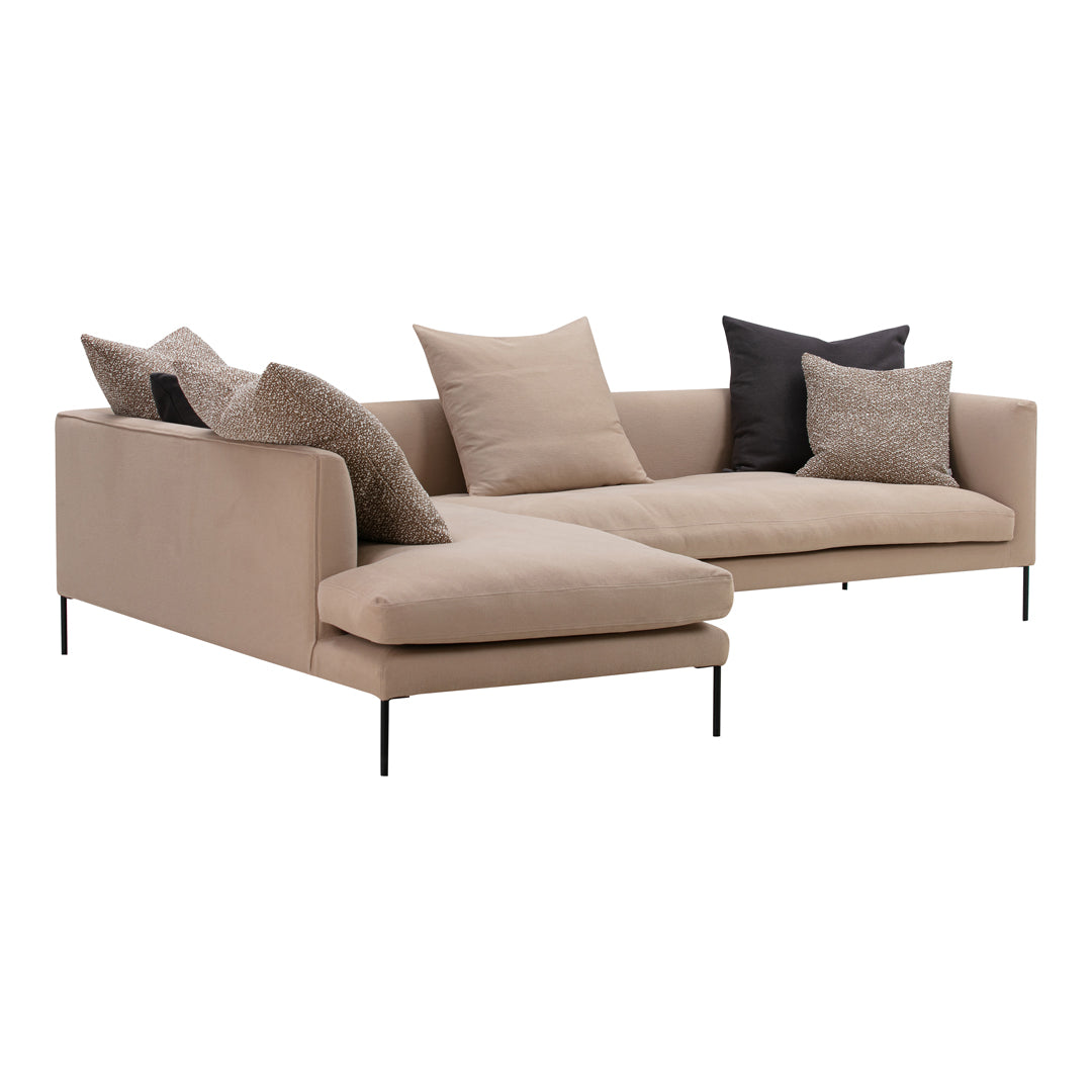Beige sectional sofa with textured gray and black accent pillows, featuring clean lines and modern design.