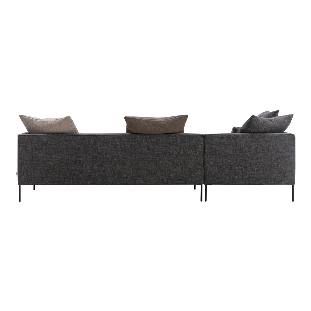 Dark gray sofa with textured fabric and brown accent pillows, perfect for modern living spaces.