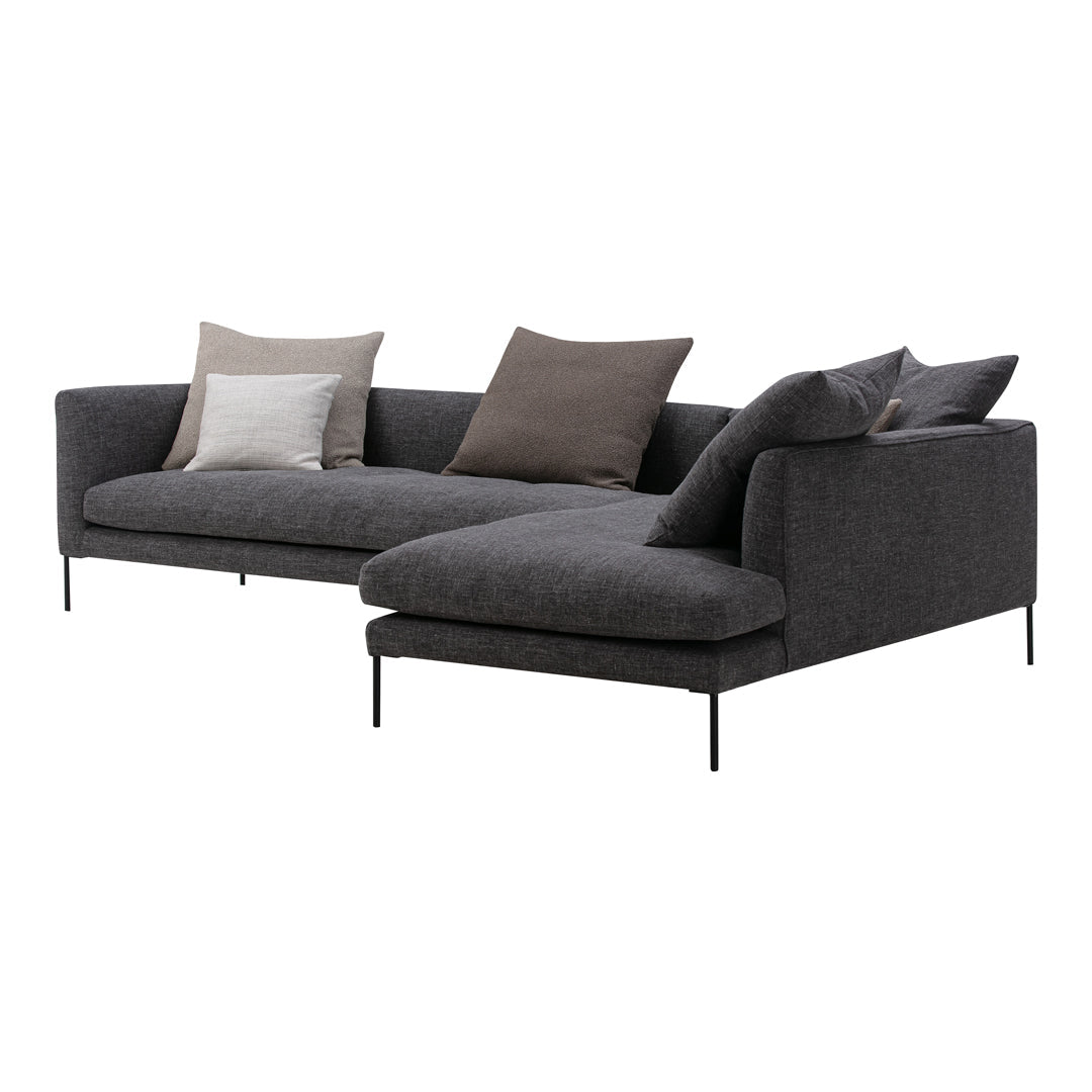 Dark gray sectional sofa with a sleek design, featuring subtle textured fabric and elegant accent pillows in neutral tones.