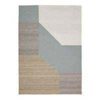 Geometric area rug featuring soft blue, beige, and cream color blocks with textured patterns. Perfect for modern decor.