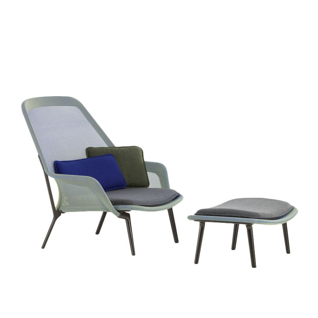 Light green and gray modern lounge chair with patterned cushions in blue, green, and gray, plus matching ottoman.