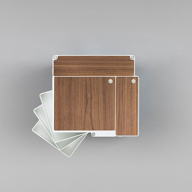 Modern desk organizer in rich wood grain and sleek white with minimalist design and soft, neutral tones.