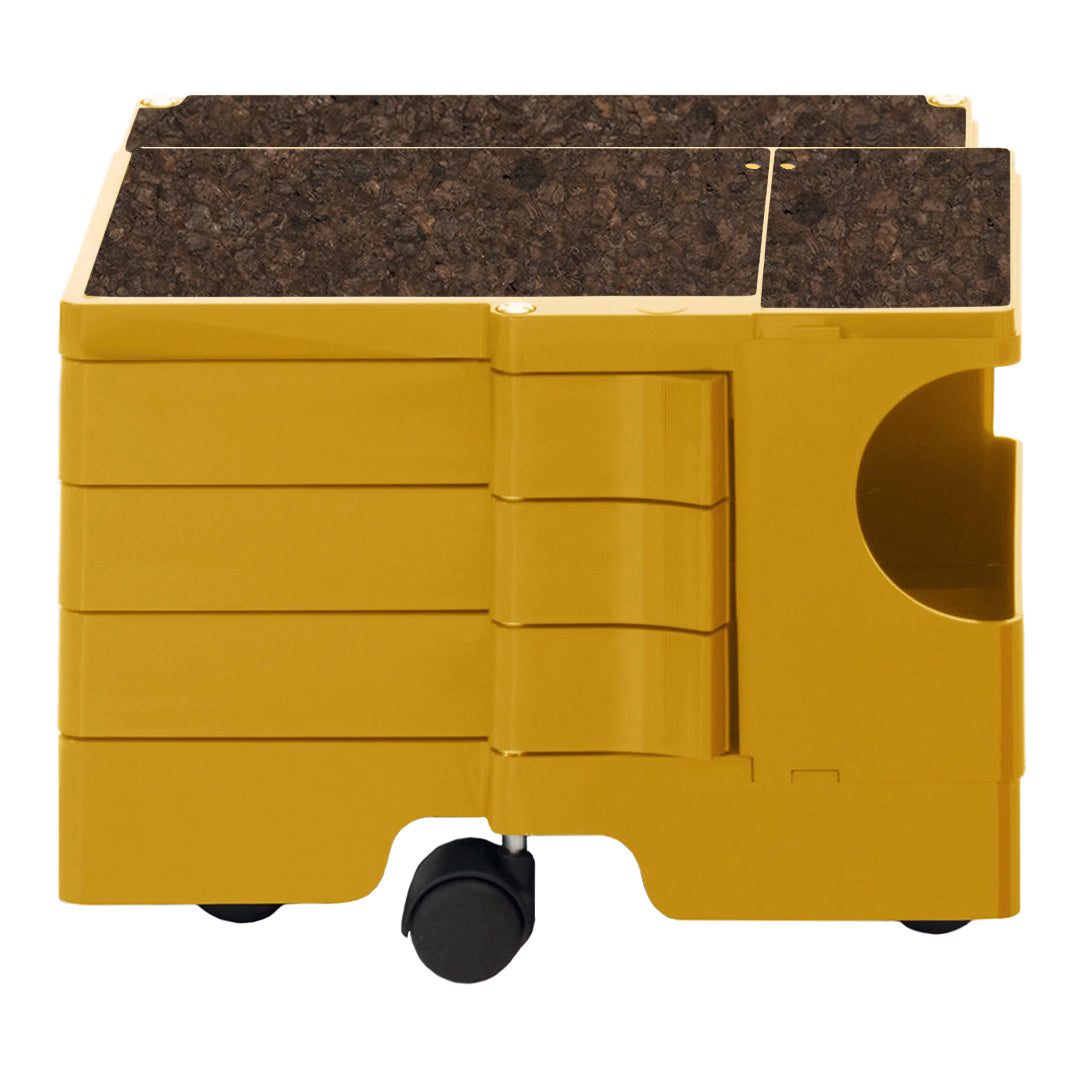 Yellow storage box with a brown cork top and smooth finish, featuring a modern design and rolling wheels.