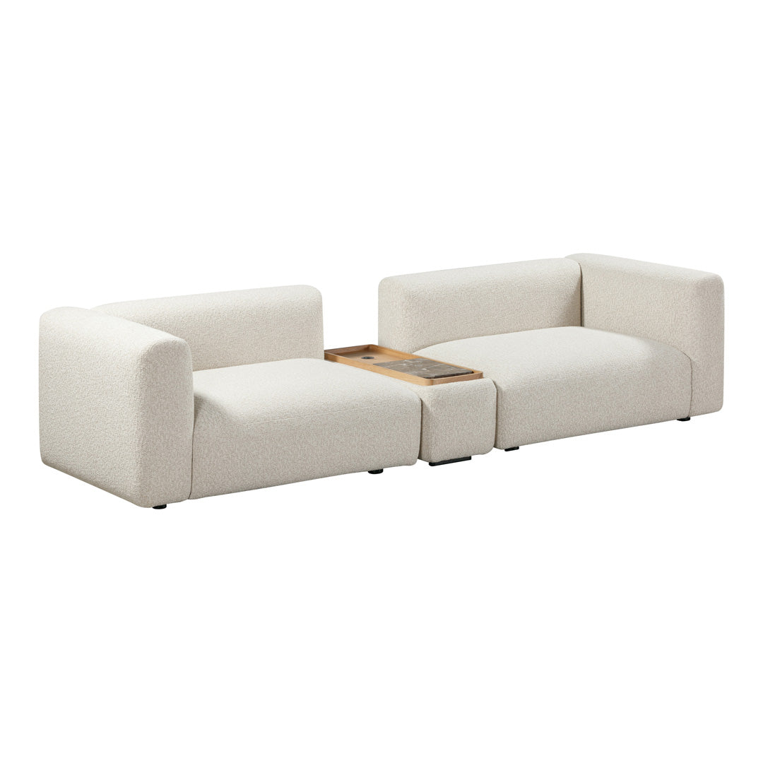 Beige modular sofa with a textured fabric and minimalist design, featuring a wooden accent table. Perfect for modern decor.