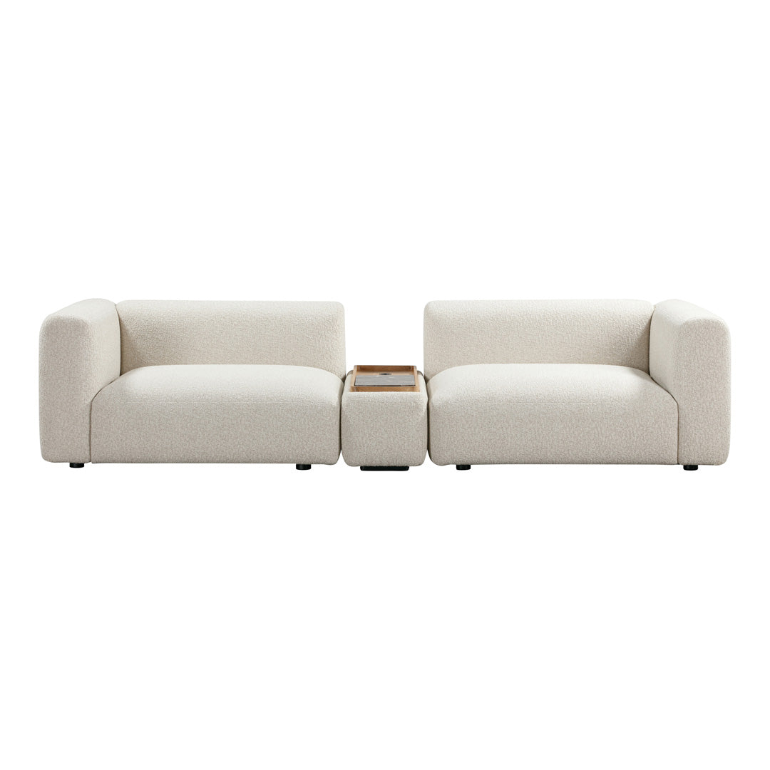 Cream-colored modern sofa with clean lines and soft upholstery, featuring a minimalist design and integrated side table.