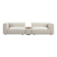 Modern cream-colored sofa with minimalistic design and plush cushions. Versatile for any contemporary living space.