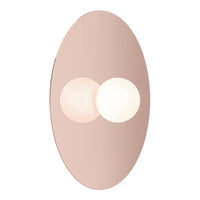 Oval pink wall sconce with two glowing spherical lights and a smooth, reflective surface. Elegant modern design.