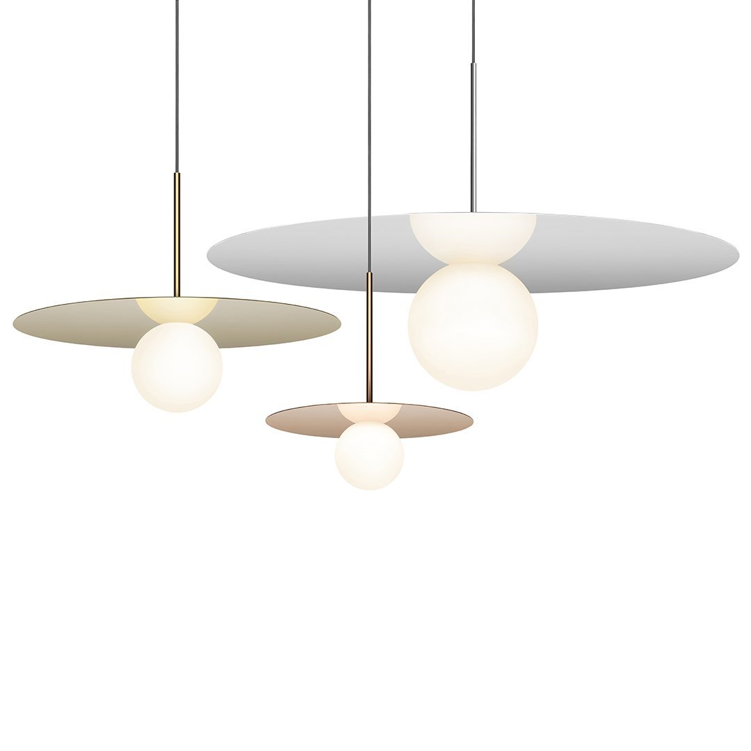 Modern pendant lights featuring white and cream globes with sleek gray and beige circular shades.