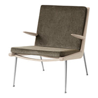 Sleek mid-century chair in muted olive green fabric with light wood accents and silver legs.