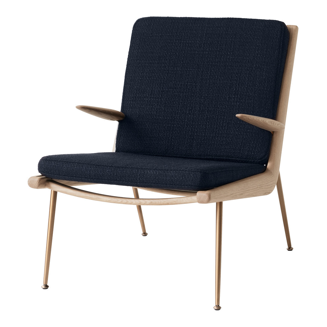 Navy blue textured fabric armchair with light wood frame and sleek gold legs, perfect for modern decor.
