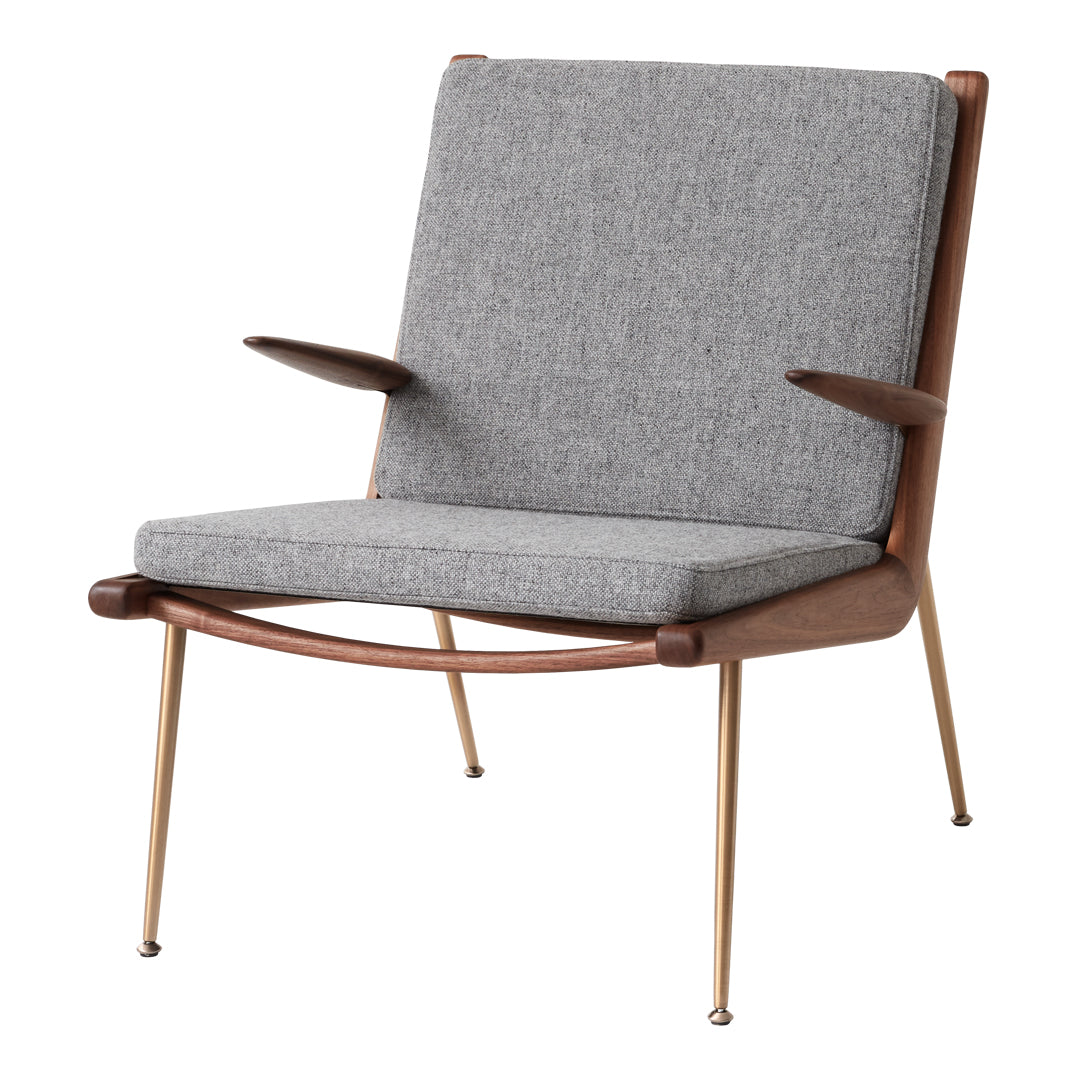 Gray fabric armchair with a clean, modern design and wood accents, featuring simple, elegant lines.