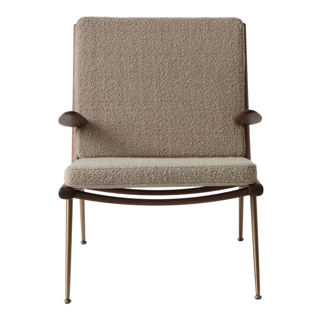 Light beige textured upholstery chair with wooden armrests and slender metal legs. Modern and minimalist design.