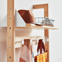 "Natural wood shelf with brown hat, black wire basket, and patterned scarves in warm colors."