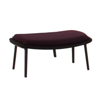 Deep burgundy upholstered ottoman with a sleek, dark wooden base and smooth curves. Elegant and modern design.