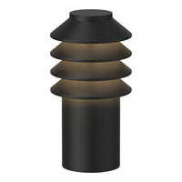 Black cylindrical lamp with layered, conical shades and warm ambient glow. Modern design for stylish interiors.