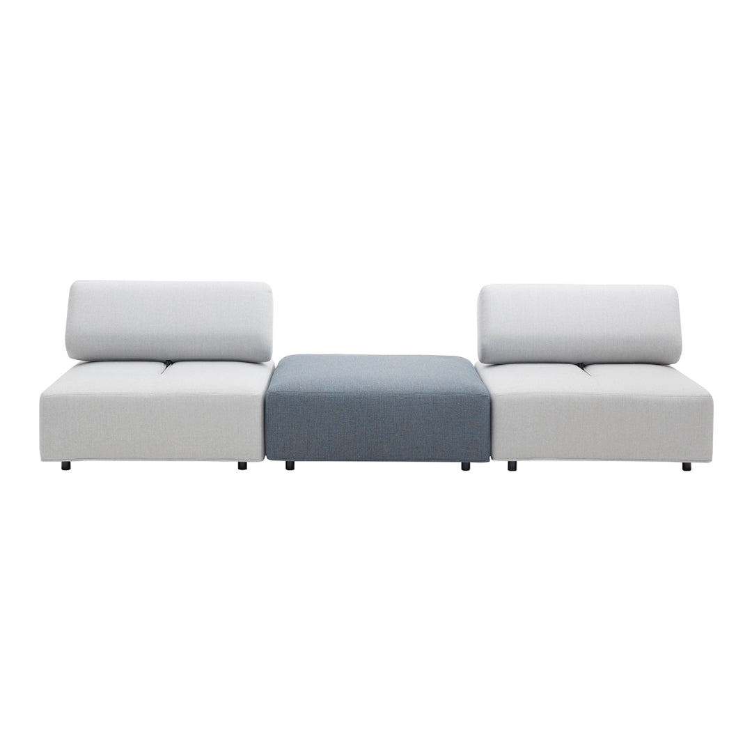 Modern sofa featuring a sleek white design with a contrasting blue center cushion. Minimalist style with clean lines.