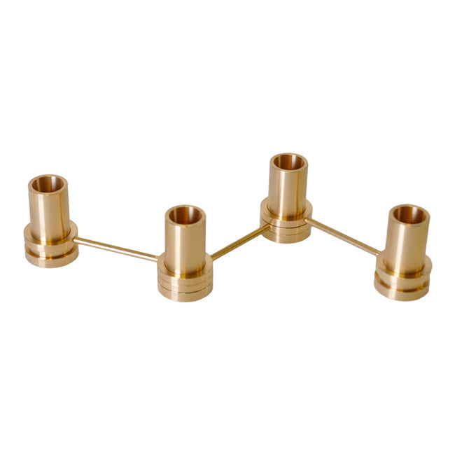 Brushed gold candle holder with sleek, modern design and multiple holders arranged in a stylish linear pattern.