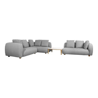 Light gray modular sofa set with soft fabric and minimalist design, featuring plush cushions and wooden legs.