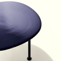 Navy blue round table with a smooth surface and black metal legs, minimalist design on a light background.