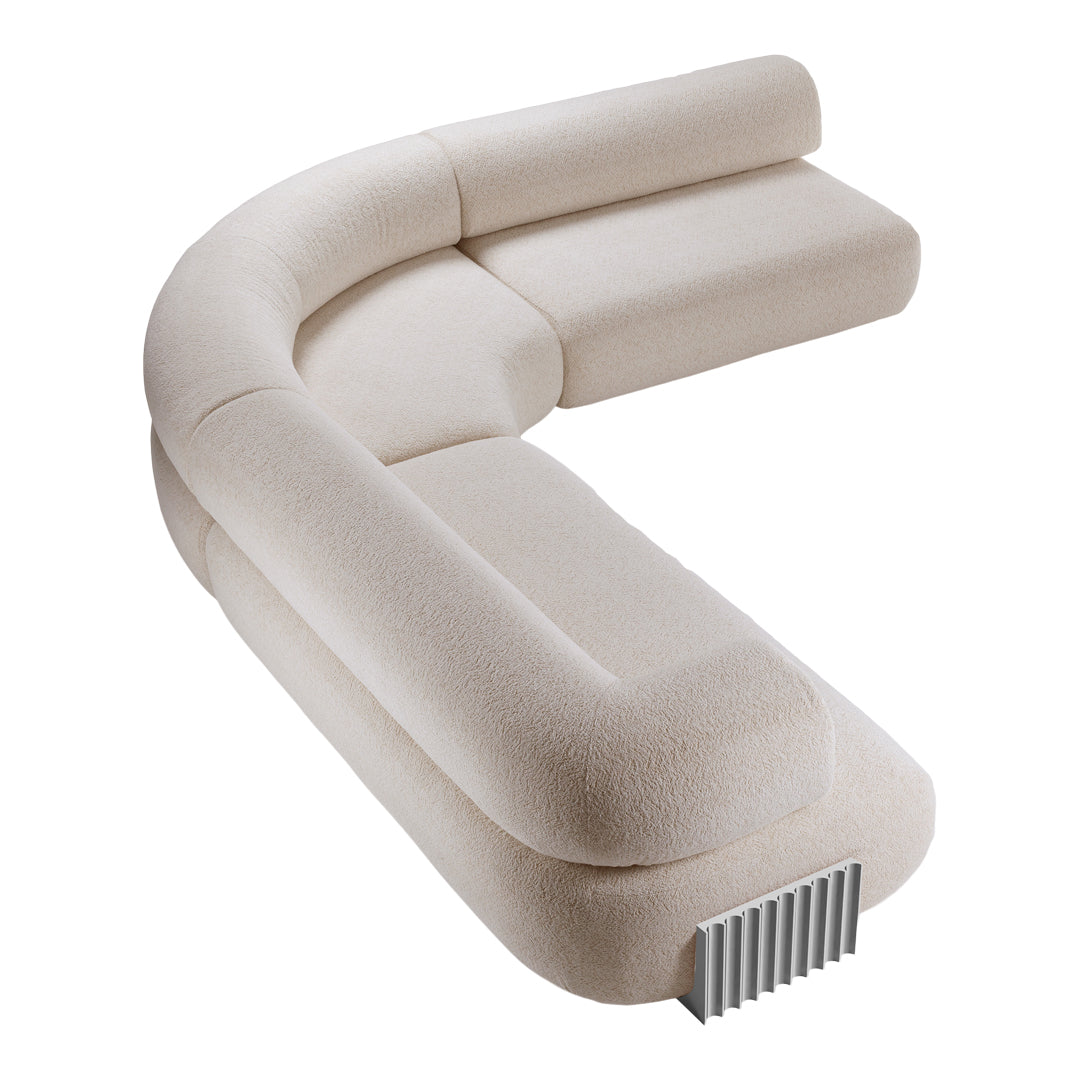 Beige curved sectional sofa with soft texture and minimalistic design, featuring a subtle pattern for a modern look.