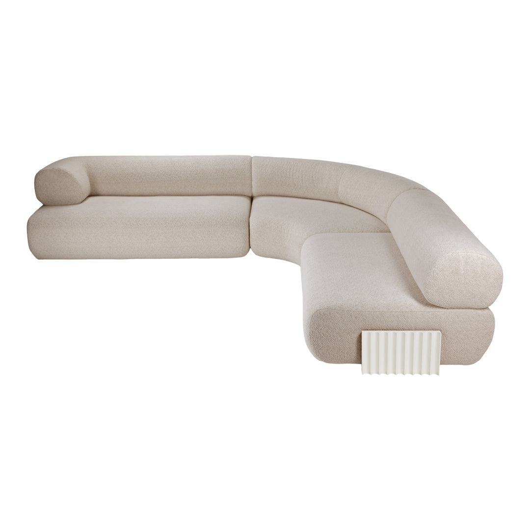 Curved sectional sofa in soft beige fabric with a subtle textured pattern, complementing any modern decor.